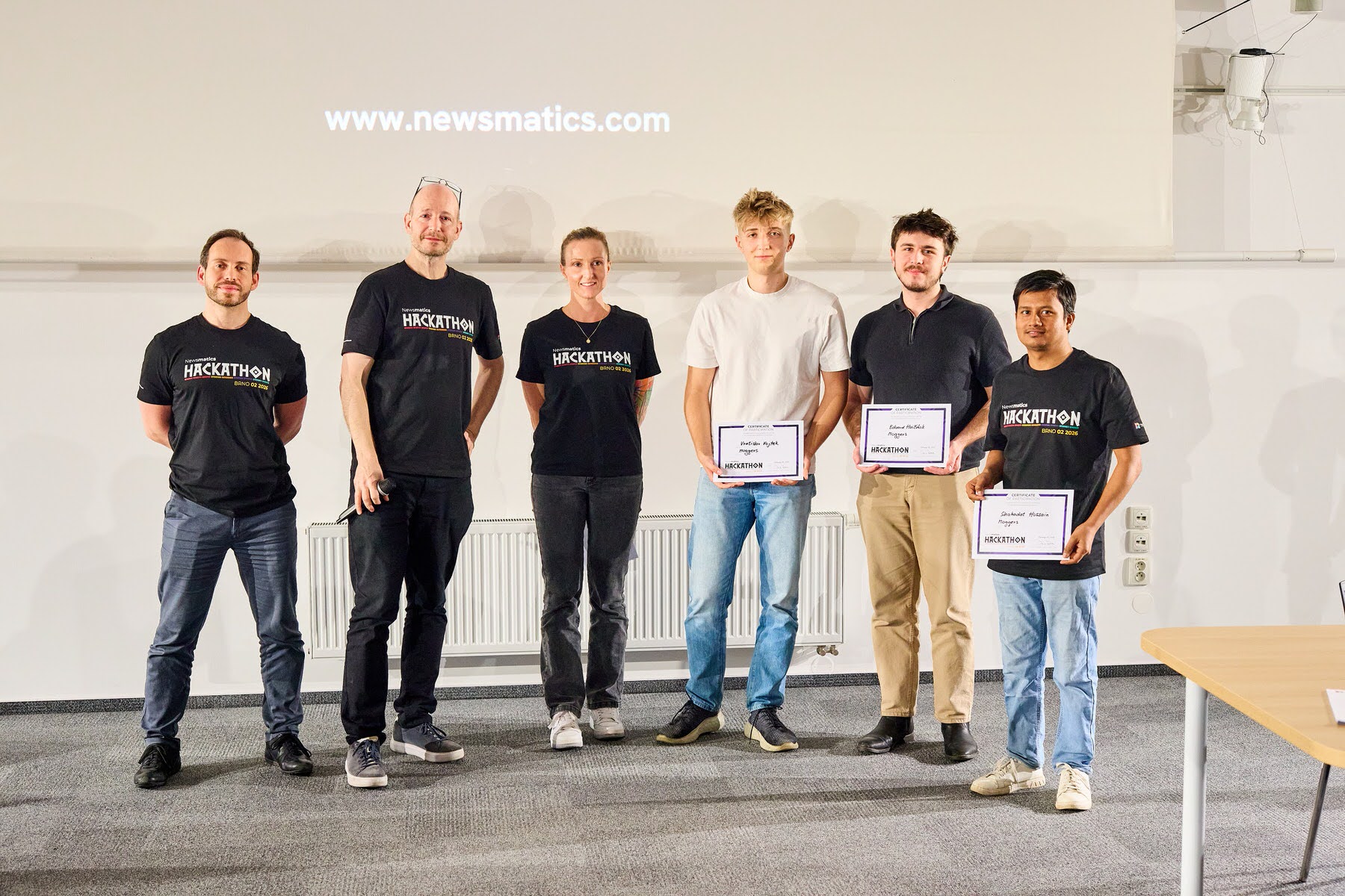 Award ceremony at the Newsmatics Hackathon with participants holding certificates